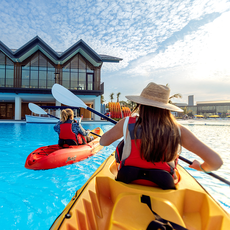 Kayaking in Evermore Bay Image of guests kayaking in the crystal clear waters of Evermore Bay at Evermore Orlando Resort.
