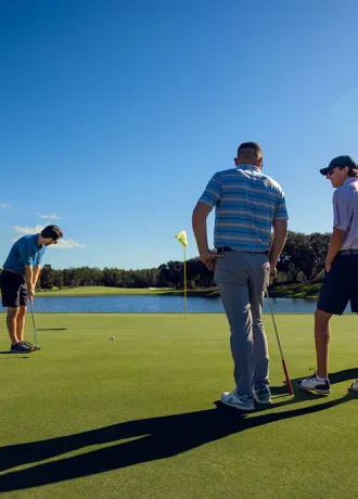 Golfers putting on Island Green