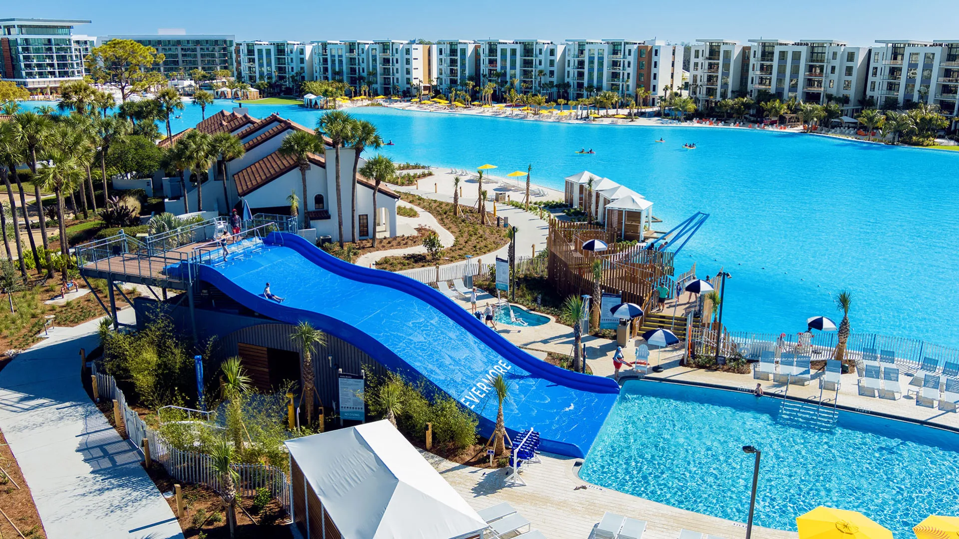 Family Waterslide Pool & Blue Hole Image of the Family Waterslide Pool and Blue Hole amenities by Evermore Bay at Evermore Orlando Resort.