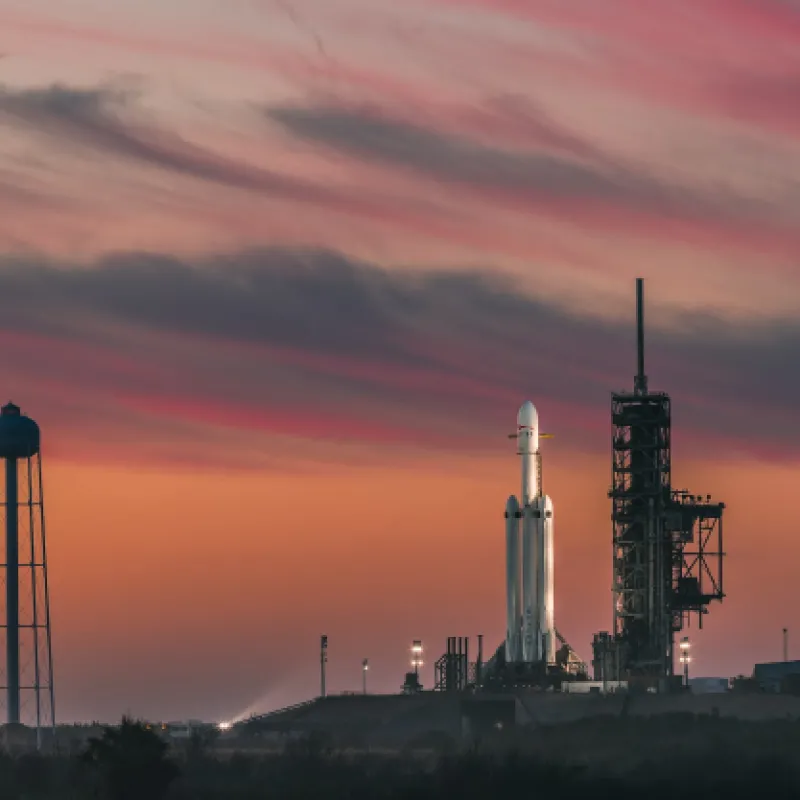 Kennedy Space Center with rocket on launch pad during sunset 