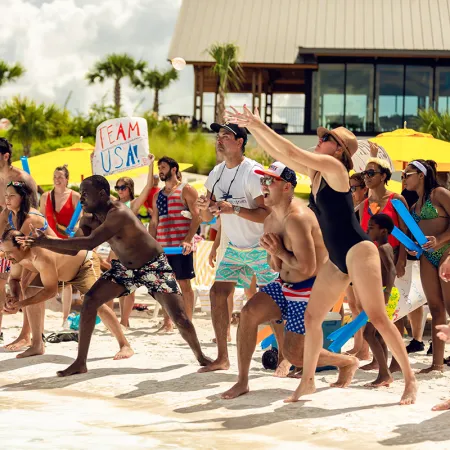 Bay Games Competition Image of guests participating in a fun competition during Evermore Bay Games at Evermore Orlando Resort.